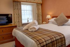 
A bed or beds in a room at The Winnock Hotel, Sure Hotel Collection by Best Western

