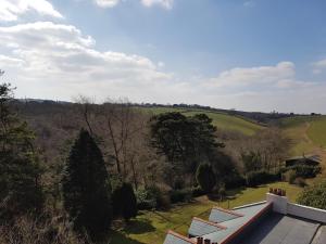 a view of the countryside from the roof of a house at Great Trethew Manor Hotel & Self Catering Lodges in Liskeard
