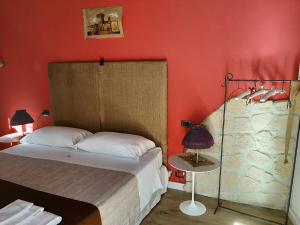 A bed or beds in a room at Torre della Botonta