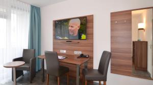 TV a/nebo společenská místnost v ubytování Neu Heidelberg - Guesthouse & Apartments