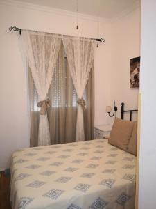 Un pat sau paturi într-o cameră la Tabano