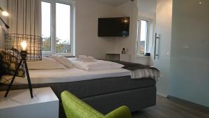 Ein Bett oder Betten in einem Zimmer der Unterkunft Hotel in Herrenhausen