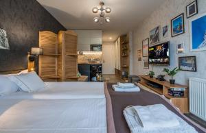 Ένα ή περισσότερα κρεβάτια σε δωμάτιο στο Powderinn • Gudauri