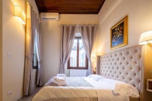 Säng eller sängar i ett rum på Duomo Apartments