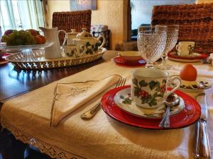 a table with a plate of food on a table at CasAda - Aria Condizionata in Lessona