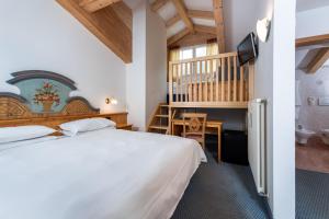 Postel nebo postele na pokoji v ubytování Hotel Valacia