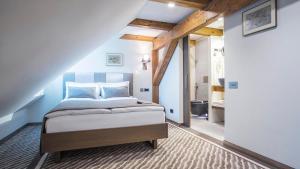 Postel nebo postele na pokoji v ubytování Michaelson Boutique Hotel & SPA Brícoła