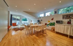 a kitchen and dining room with a table and chairs at Casa Vita Apartments in Saalbach Hinterglemm