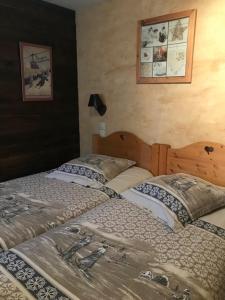 two beds sitting next to each other in a bedroom at Chalet Chez Gaby in Morzine