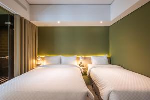 Postel nebo postele na pokoji v ubytování Ramble Hotel