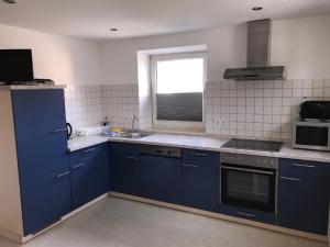 Kuchyň nebo kuchyňský kout v ubytování Ferienwohnung Asum