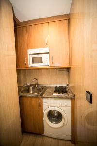 Kuchyň nebo kuchyňský kout v ubytování Hostal Caballeros