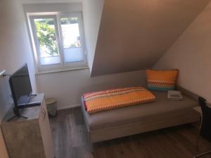 TV a/nebo společenská místnost v ubytování Ferienwohnung Asum