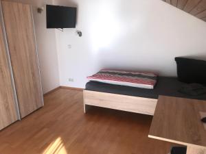 TV a/nebo společenská místnost v ubytování Ferienwohnung Asum