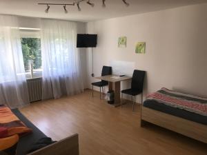 TV a/nebo společenská místnost v ubytování Ferienwohnung Asum