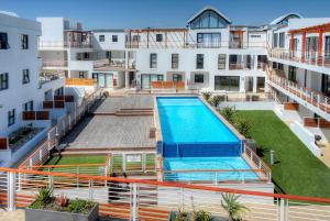 an overhead view of a swimming pool in a apartment building at Azure 25 in Big Bay