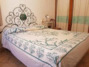 A bed or beds in a room at Casa Maria