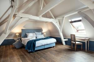 Postel nebo postele na pokoji v ubytování Ganda Rooms & Suites