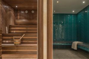 a bathroom with a staircase and green tiles at El Llorenc Parc de la Mar - Adults Only (+16) in Palma de Mallorca