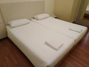 1ACS Residence客房内的一张或多张床位