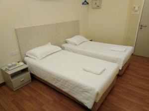 1ACS Residence客房内的一张或多张床位