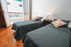 Ένα ή περισσότερα κρεβάτια σε δωμάτιο στο Milhouse Hostel Hipo +13 φωτογραφίες