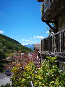 a balcony of a house with a view of a town at Maison Caramel in Landry