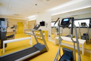 a gym with two tread machines and a treadmill at Eurostars Málaga in Málaga