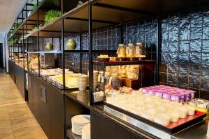 a buffet line with a lot of food on display at Eurostars Málaga in Málaga
