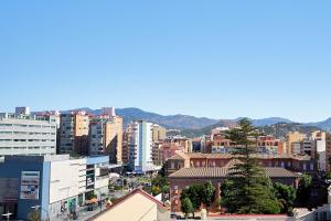 a view of a city with buildings at Eurostars Málaga in Málaga