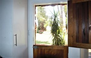 a door with a window in a room at Aranos Kalahariland Guest Farm in Aranos +40 photos