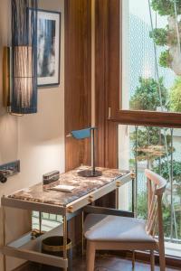 a desk with a sink and two chairs in a room at El Llorenc Parc de la Mar - Adults Only (+16) in Palma de Mallorca
