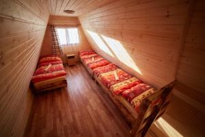 Postel nebo postele na pokoji v ubytování Autocamping Podlesok