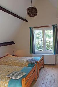 Postelja oz. postelje v sobi nastanitve Vakantiehuis de Rommelpot