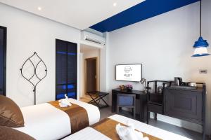 Postel nebo postele na pokoji v ubytování Aksorn Rayong, The Vitality Collection - SHA PLUS