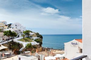 a view of the ocean from a building at Casino 4 in Carvoeiro