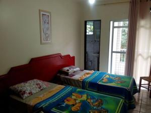 Postel nebo postele na pokoji v ubytování Maranata Hotel