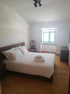 Postel nebo postele na pokoji v ubytování Casa da Praça