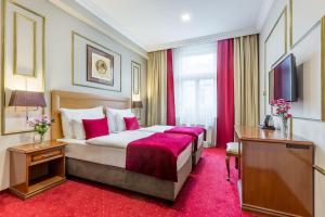 מיטה או מיטות בחדר ב-Myo Hotel Caruso