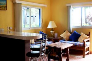 a living room with a couch and a table at Hotel Marina San Blas in San Blas