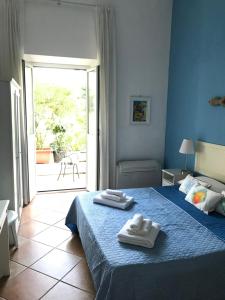 a bedroom with a bed with two towels on it at Il Miraggio in Fregene +37 photos