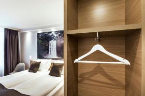 Una cama o camas en una habitación de Storm Hotel by Keahotels 56 fotos más