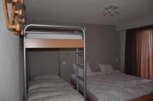 Postel nebo postele na pokoji v ubytování Immeuble Panorama