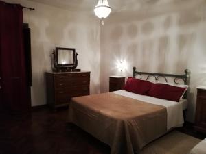 Postel nebo postele na pokoji v ubytování B&B Al Borgo