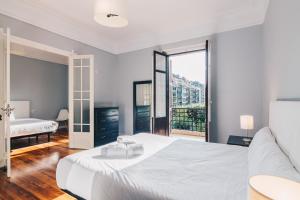 Кровать или кровати в номере Apartamento Royal