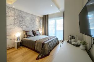 Postel nebo postele na pokoji v ubytování Quarto Novo Suite