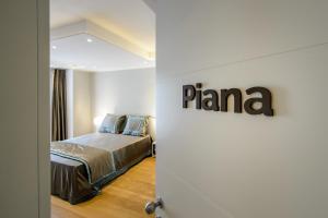 Postel nebo postele na pokoji v ubytování Quarto Novo Suite