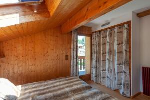 Postel nebo postele na pokoji v ubytování Balcons du Bettex