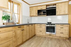 Kuchyň nebo kuchyňský kout v ubytování Ferienhaus Bognerhof