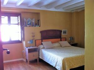 Łóżko lub łóżka w pokoju w obiekcie CASA REHABILITADA SIGLO XVIII